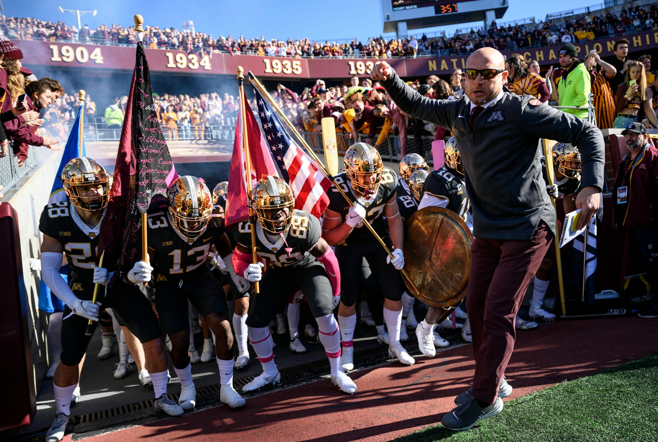 Minnesota Gophers head coach PJ Fleck leads the team onto the field before the start of a football game between the University of Minnesota Gophers and the Maryland Terrapins Saturday, Oct. 23, 2021 at Huntington Bank Stadium in Minneapolis, Minn. ] AARON LAVINSKY • aaron.lavinsky@startribune.com