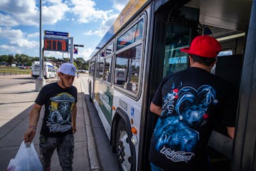 Passengers wait for the bus at the Maplewood Mall Transit Center in Maplewood, Minn., on Tuesday. The fate of the $445 million Purple Line bus-rapid